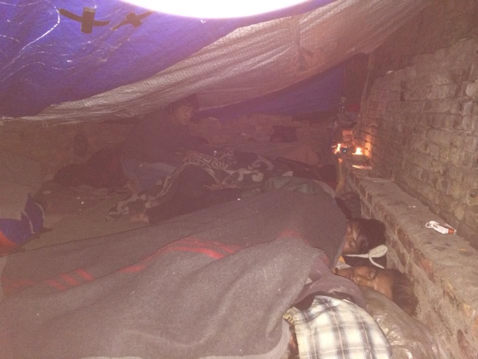 Kids sleeping in their makeshift tent